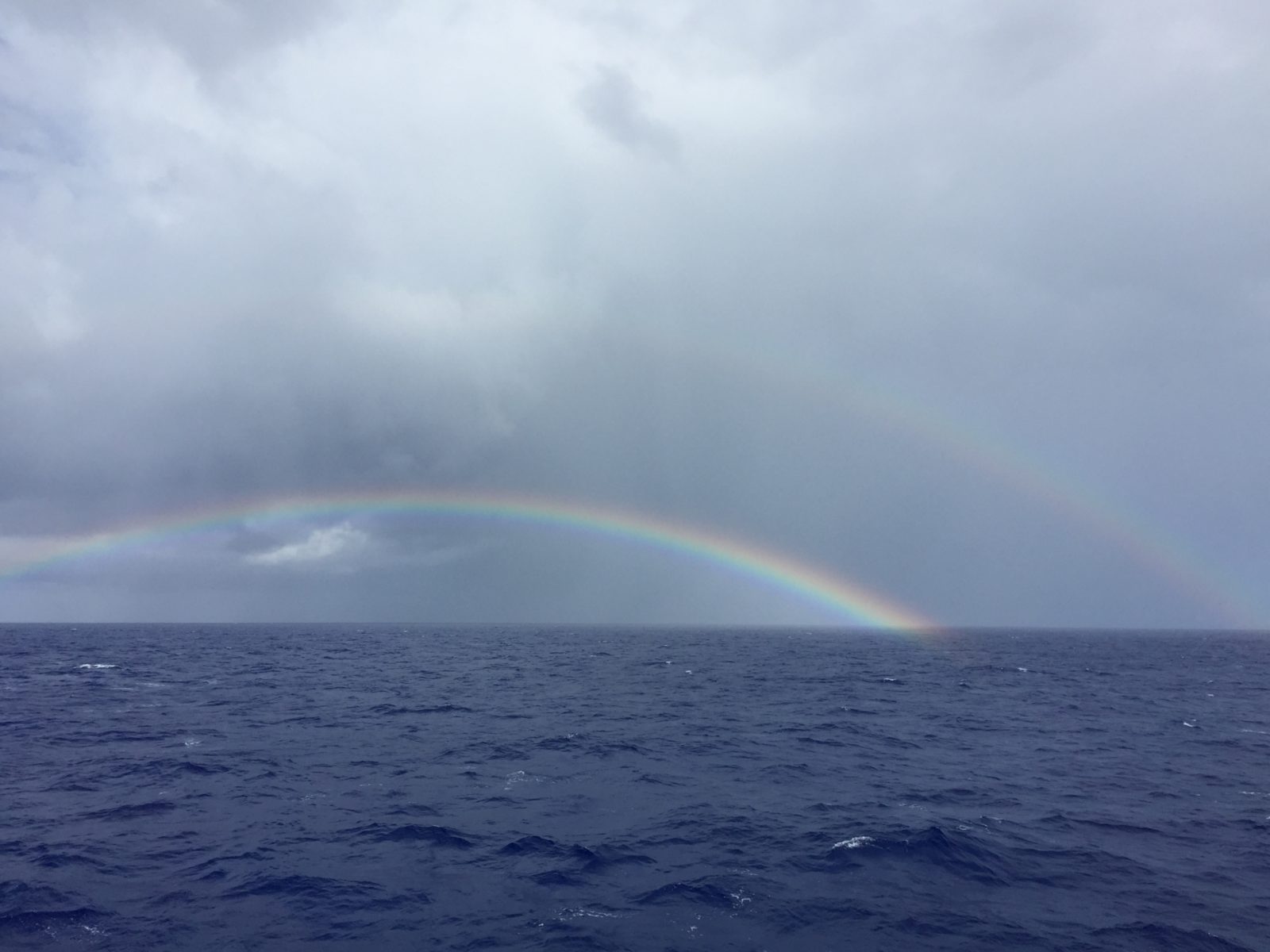 two rainbows over the ocean