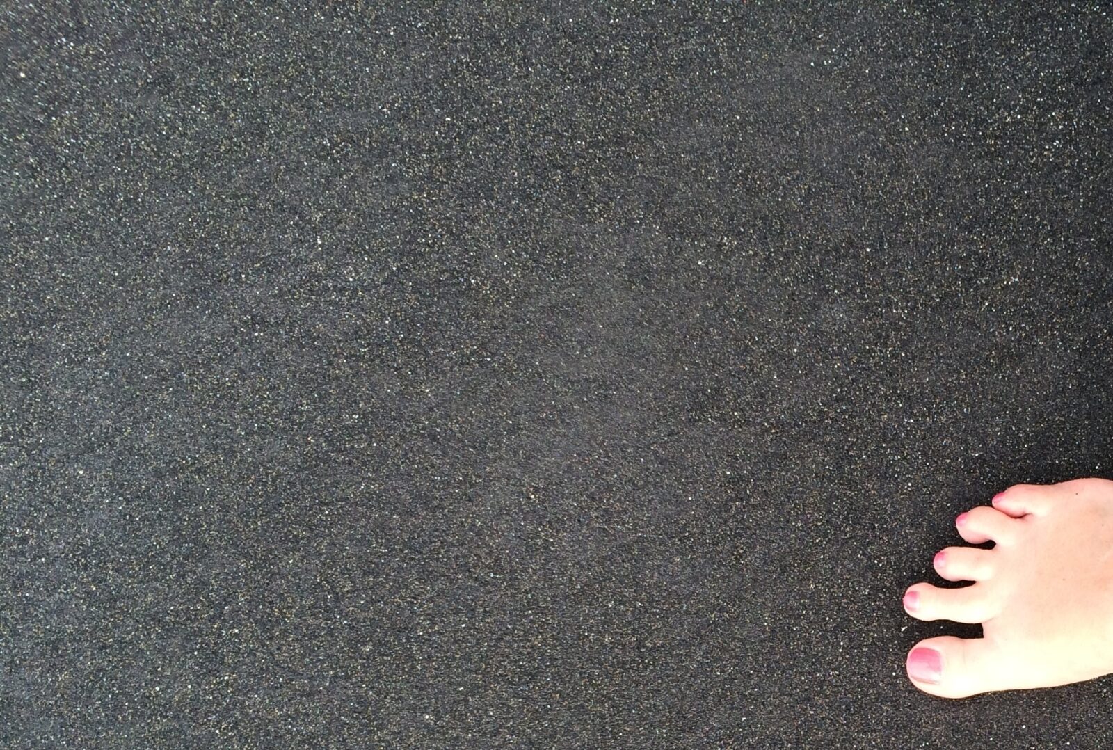 foot selfie on black sand beech