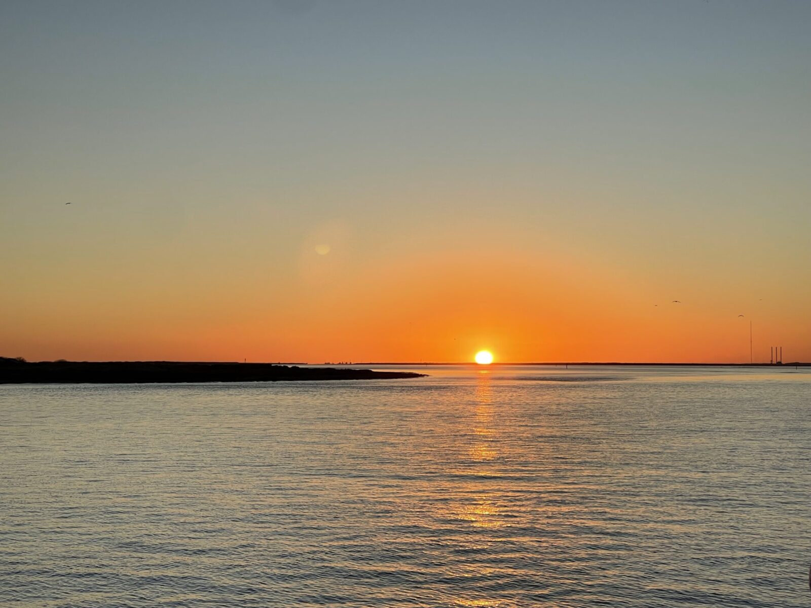 orange sun over water