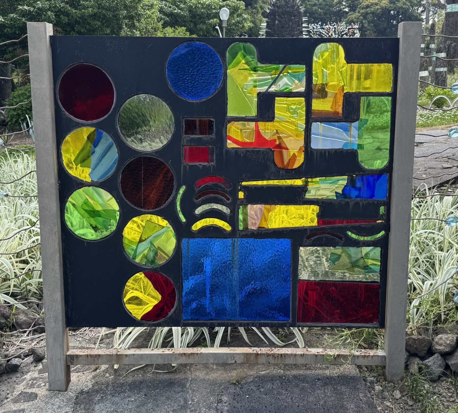 Panel with different inserts made of colorful glass