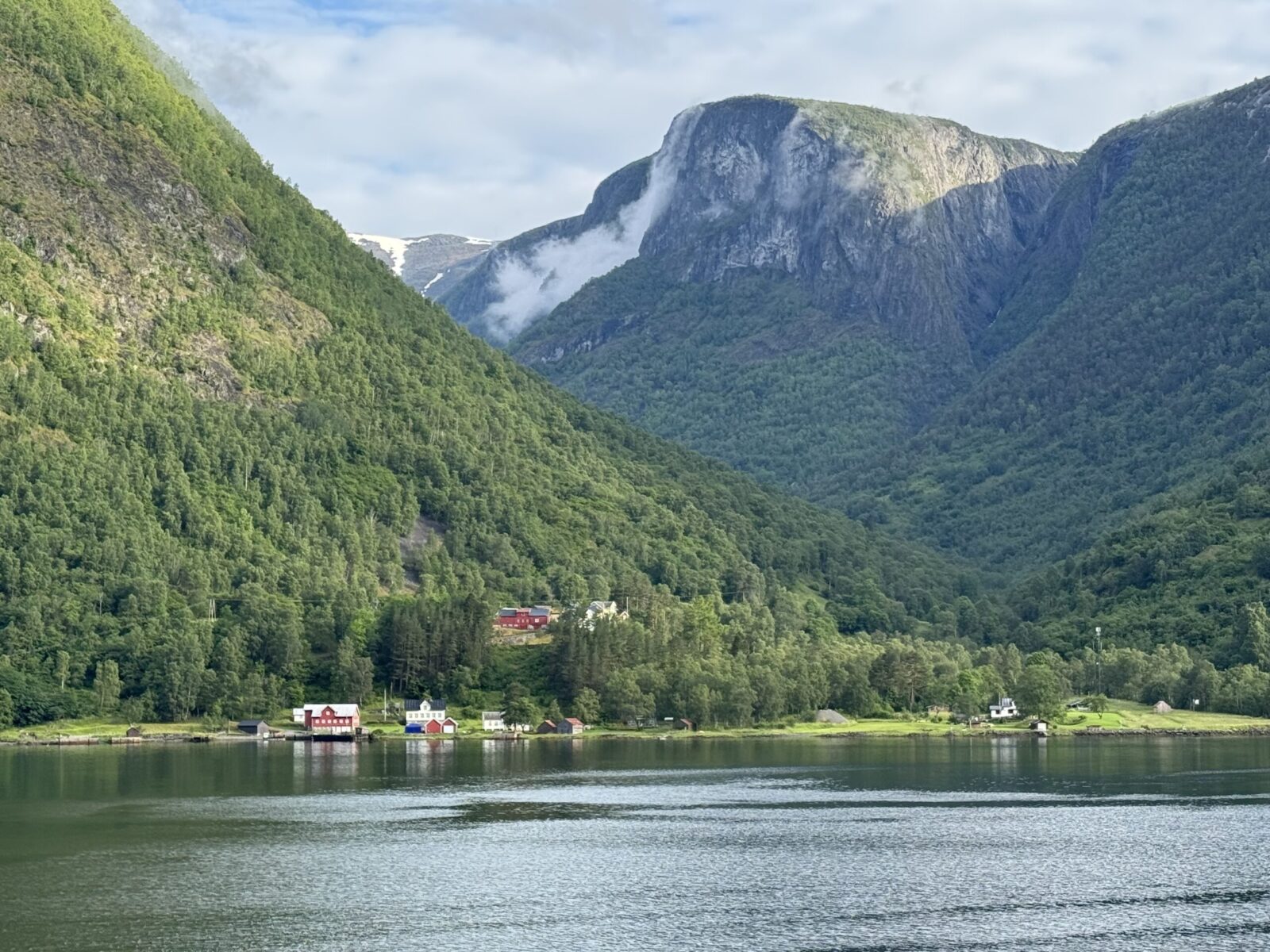 Mountains and water with houses near the shore