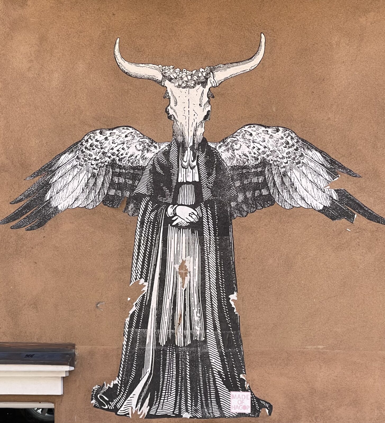 large art sticker with a bull head and angel wings