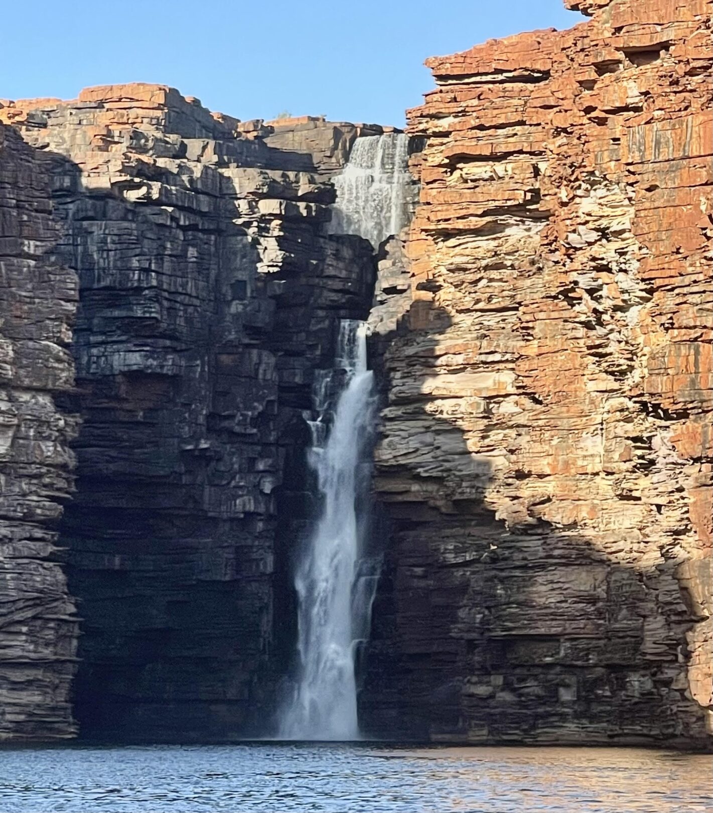 Large rock formation with waterfalls